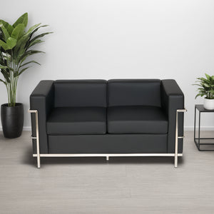Black Faux Leather 3 Seater Sofa with Indoor Plant and Side Table in Living Room Setting