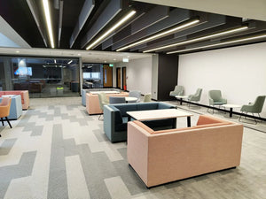 Lenny 2 Seater Low Back Chair in Different Finishes with White Top Tables in Modern Lounge Setting 3