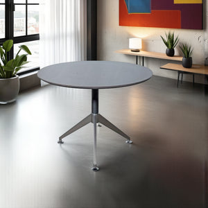 Nero Executive Anthracite Round Meeting Table Anthracite with Rectangular Table and Indoor Plants in Modern Office Setting