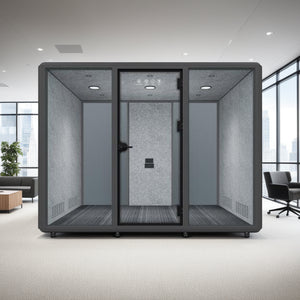 Silentium 6 Person Meeting Pod Slate Grey with Black Armchair and Wooden Coffee Table in Modern Office Setting