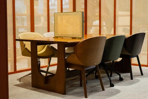 Sund M Wooden Meeting Room Table with Wooden Tub Chair and Desk Screen in Modern Office Setting