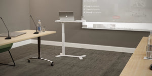 AV8 Air Height-Adjustable Desk White in Boardroom Setting