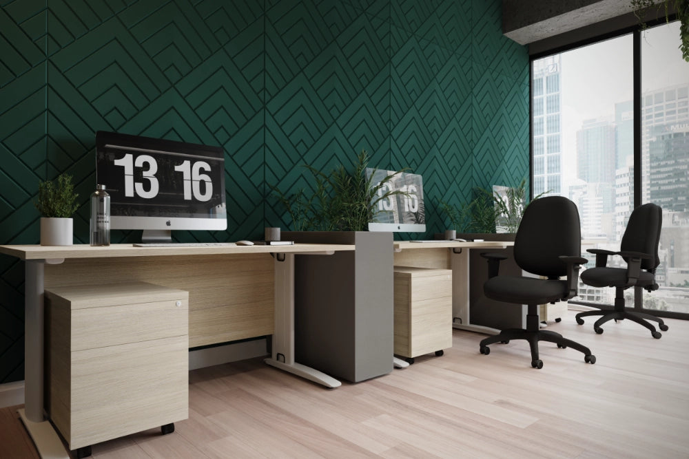 Acoustic Wall Panel in Dark Green with Sit Stand Desk and Black Armchairs in Office Setting
