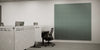 Acoustic Wall Panel in Grey with Grey Acoustic Screens in Black Desk and Black Chair