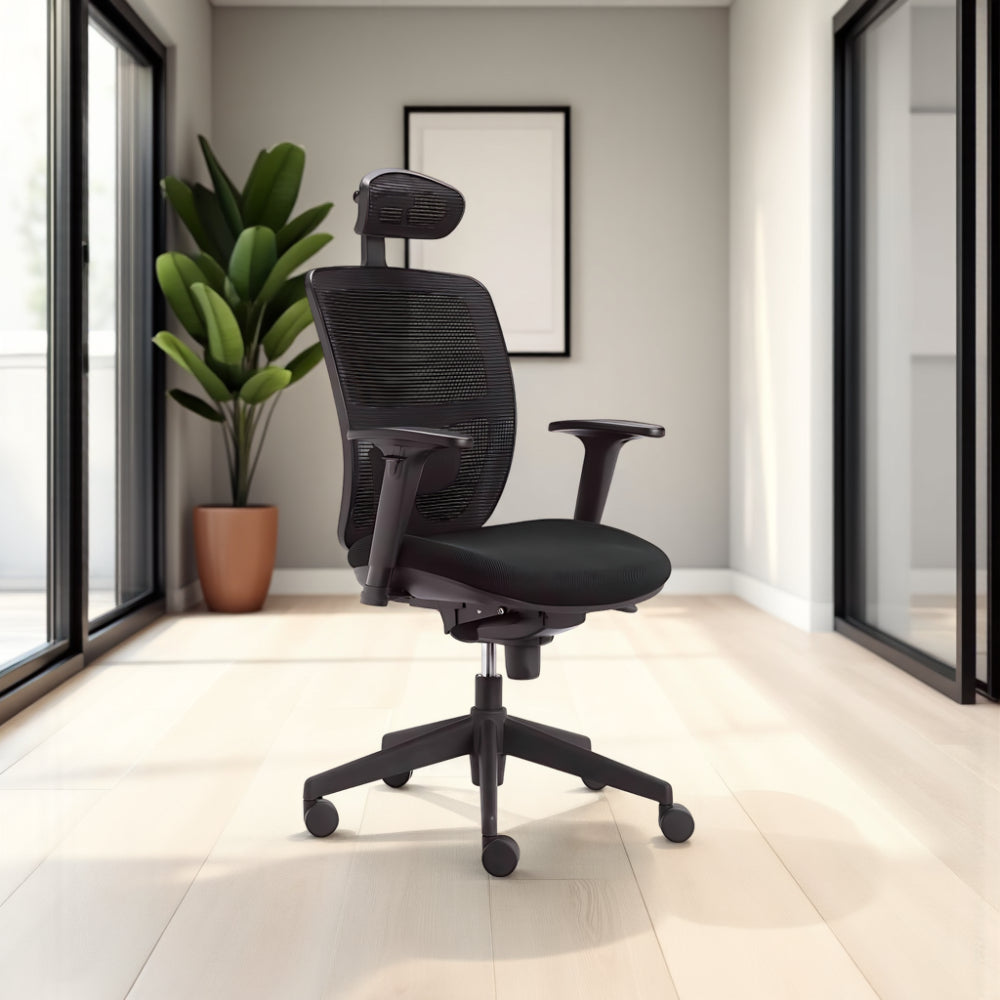 Action Ergonomic Mesh Chair in Black Finish with Indoor Plant in Modern Office Setting