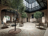 Ado Chair With Wooden Armrests In Light Brown With Grey Coffee Table In Indoor Patio