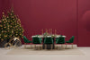 Aero Dining Table in Black Finish with Green Chair and Christmas Tree in Studio Setting