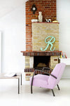 Age Armchair with Wooden Coffee Table and Antique Wall Clock in Living Room Setting