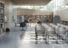 Artesia Stackable Chair With Bookshelves And Freestanding Screen In Library Setting