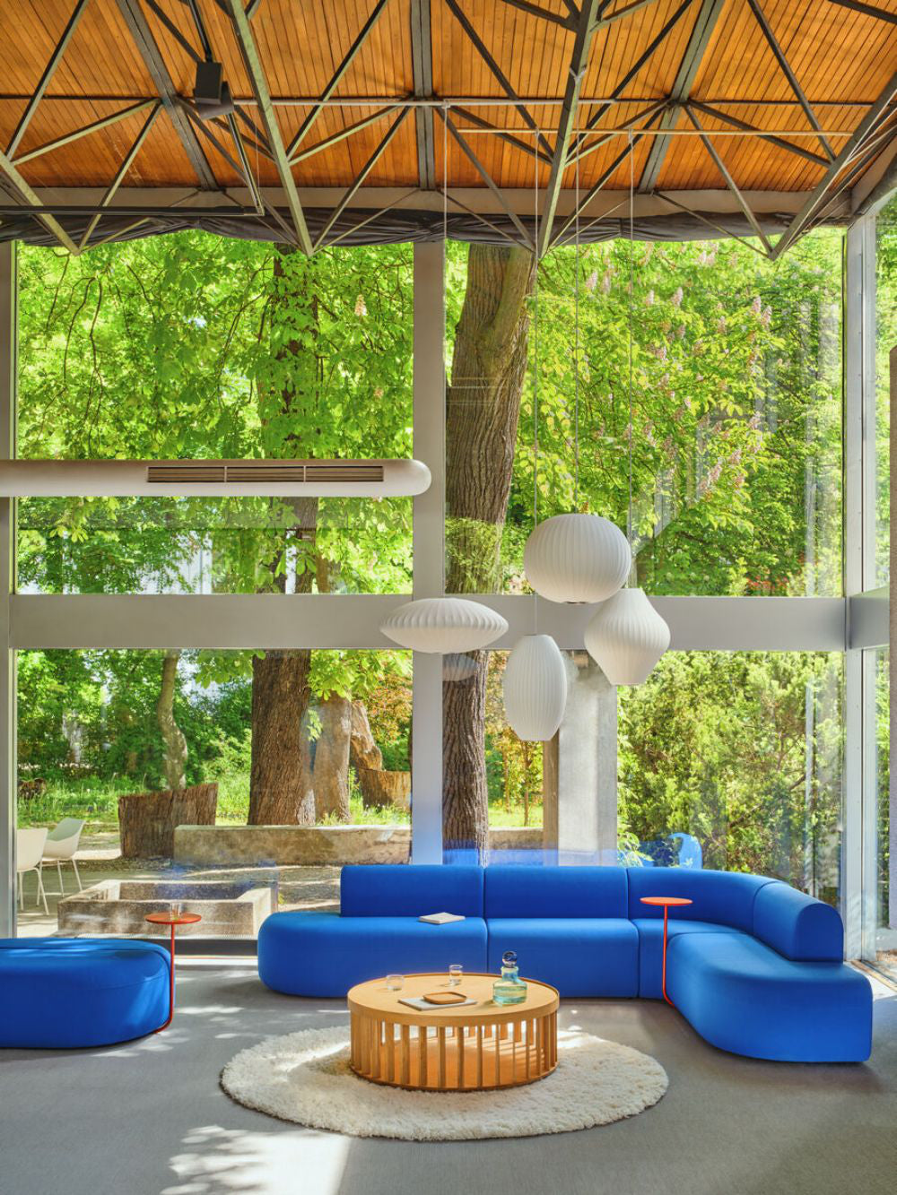 Artiko Upholstered Modular Seating With Coffee Table And Floor Rug In Breakout Setting 2