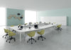 Barrel Shaped Boardroom Table with Centre Space in White Finish with Tub Chair in Collaborative Setting