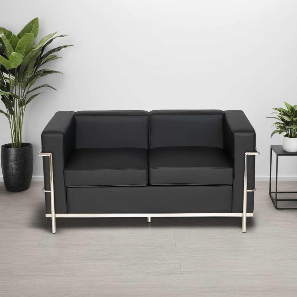 Black Faux Leather 3 Seater Sofa with Indoor Plant and Side Table in Living Room Setting