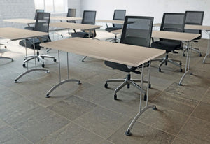 Buronomic Rectangular Folding Table With 90 Degrees Links In Oak Top Finish With Black Armchair In Classroom