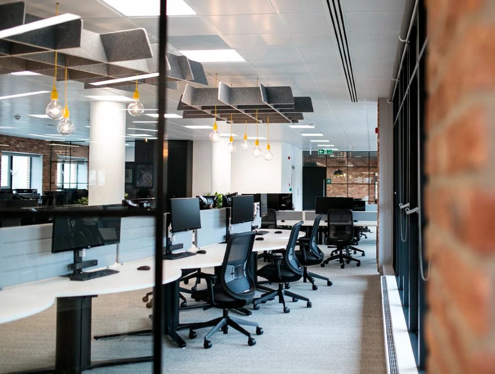 BuzziGrid Sound Absorbing Ceiling Solution 8 in Grey with Black Chair in Office Area Settings