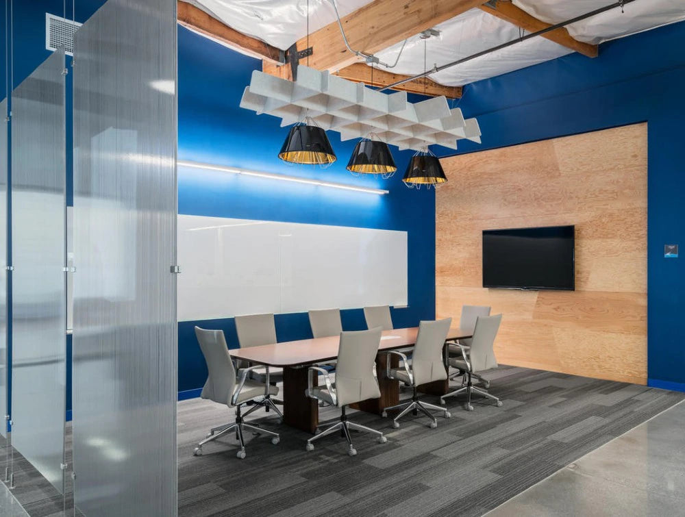 BuzziGrid Sound Absorbing Panel with Rectangular Table and Swivel Chair in Meeting Area