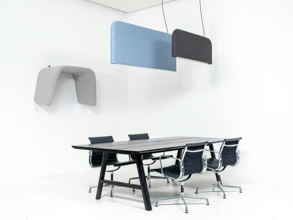 BuzziShield Acoustic Ceiling Light with Armchair and Table in Office Setting