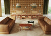 Drum Oval Low Coffee Table with 3 Seater Sofa and Wooden Table in Modern Office Setting