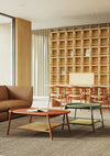 Drum Oval Low Coffee Table with Meeting Room Chair and Bookshelves in Modern Office Setting