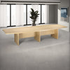Elite Barrel Shaped Boardroom Table with 3 Panel Legs and Indoor Plant in Modern Office Setting 2