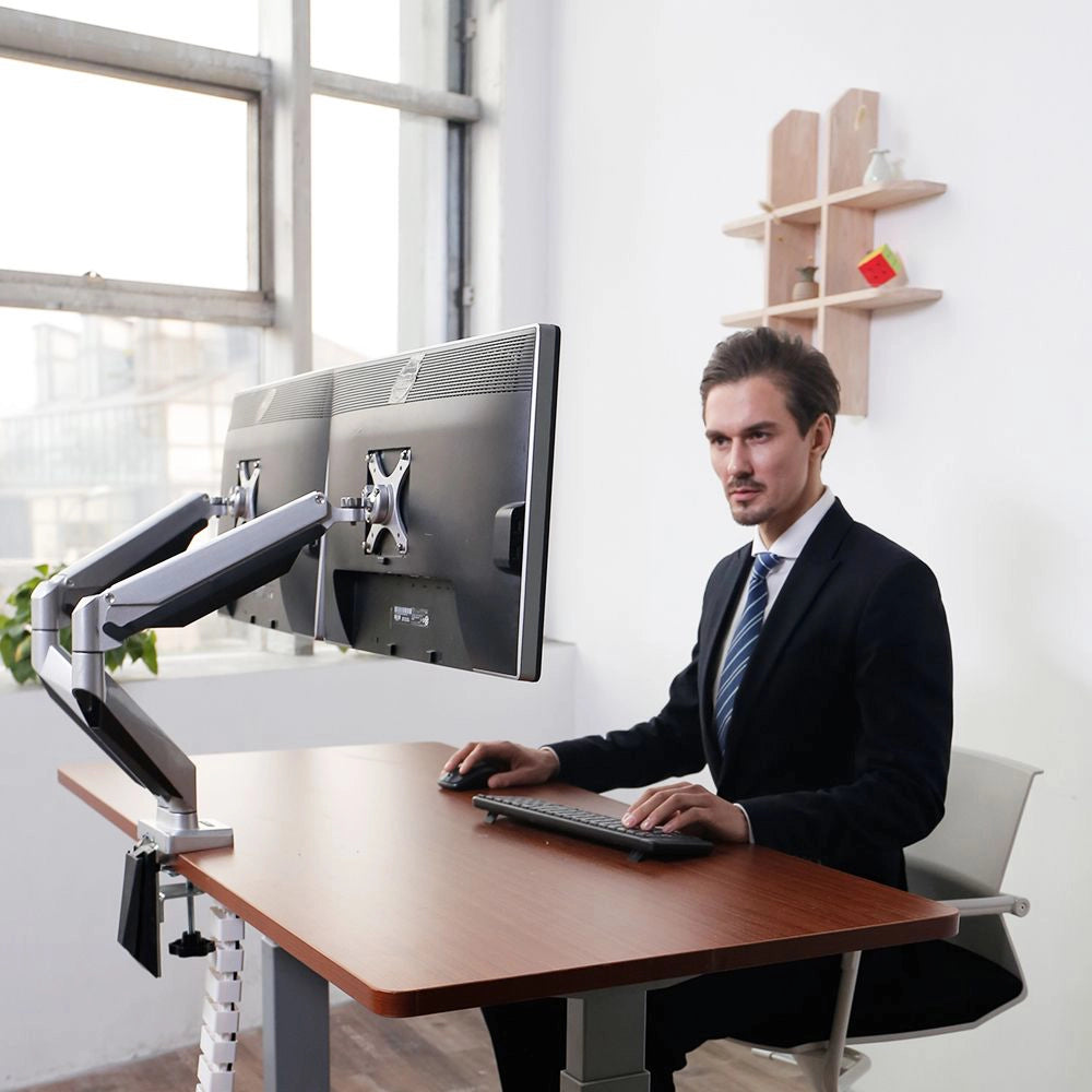 Emma Gas Spring Dual Monitor Arms in White with White Cable Spine in Modern Office Setting