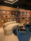 Emme Modular Seating Curved Seating with Black Top Coffee Table and Blue Armchair