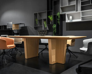 Gravos Conference Table in Oak Finish with Tub Chairs in Modern Meeting Room Setting with Hanging Bookshelf in Office Setting