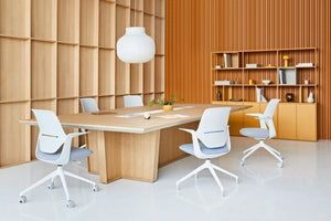 Gravos Conference Table in Oak Finish with White Armchair and Oak Bookcase with Storage in Modern Office Setting