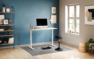 Gymba Ergonomic Foot Board with Sitstand Desk and Black Stool in Home Office Setting