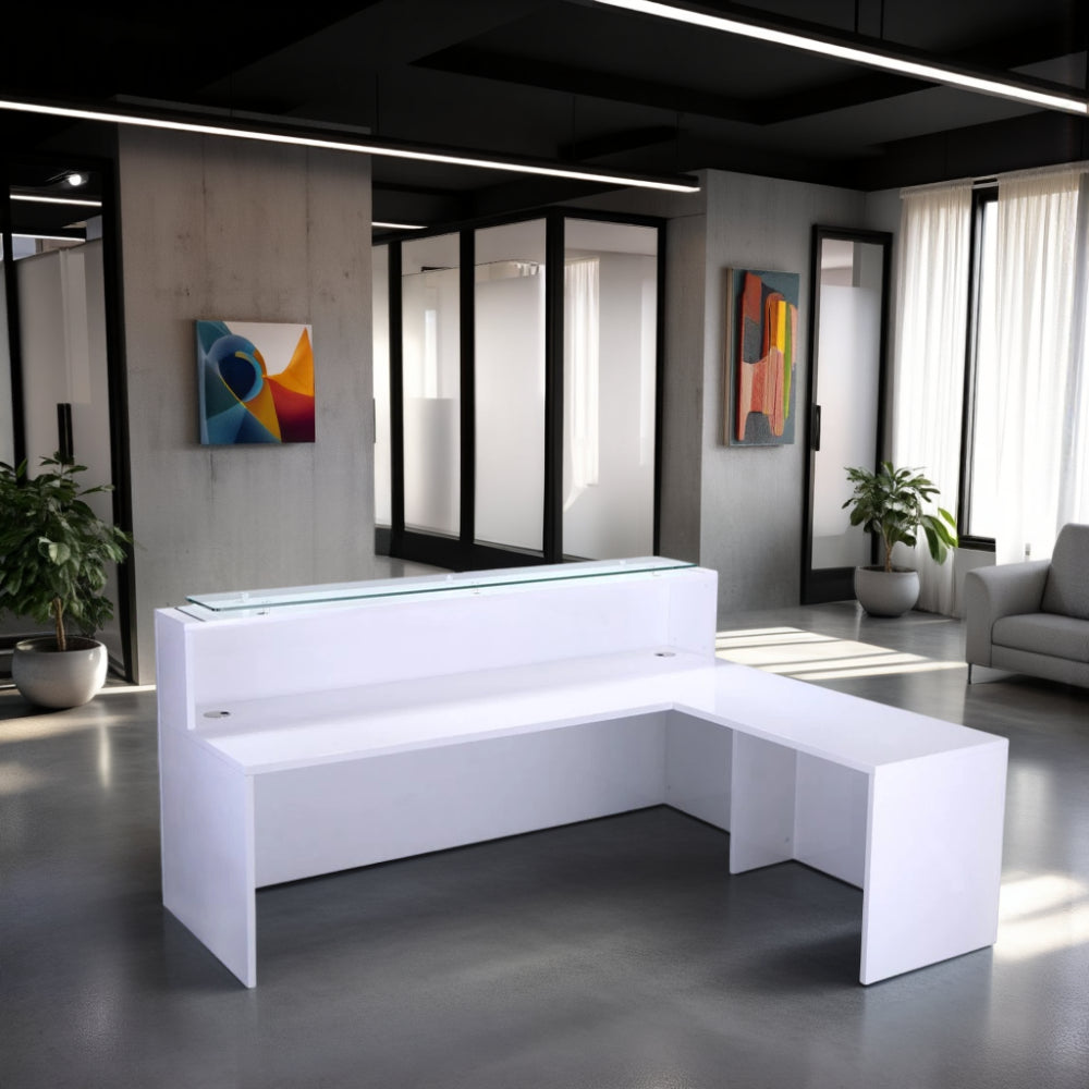High Gloss White Return Reception Desk with Indoor Plant and Sofa in Reception Setting