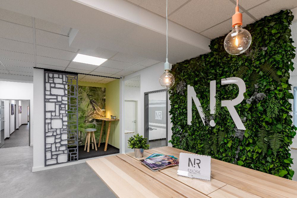 Java Acoustic Vertical Garden in Green Finish with High Table and Stool in Breakout Setting