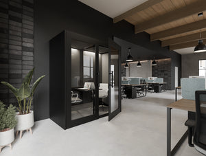 Kai Premium Meeting Pod in Black with Gesture Meeting Room Chair and Aria Ergonomic Chair and Light Desk Screen Attached in Key Bench Desk in Modern Office Setting