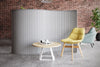 Koala Acoustic Curved Screen Divider in Grey with Yellow Chair and Small Round Coffee Table
