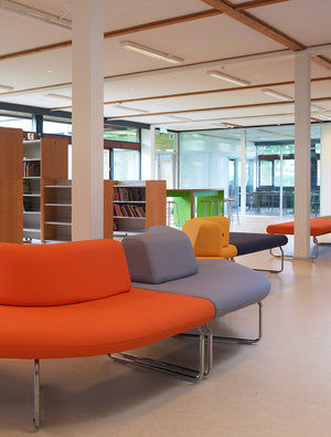 Legvan 90 Upholstered Modular Seating with Bookshelves in Library Setting