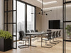 Levo Meet Sit Stand Table with Vela Sled Base Chair in Boardroom Setting 2