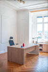 Mito Executive Wooden Desk with Ergonomic Chair and Table Lamp in Modern Office Setting