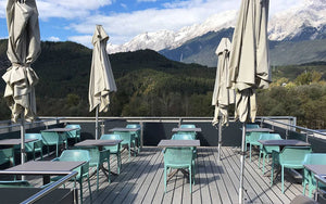 Nardi Clip Outdoor Table in Anthracite with Green Armchair and Patio Umbrella in Rooftop Settings