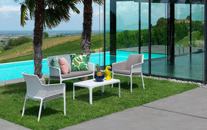 Nardi Net Coffee Table in White with Matching Armchair and Sofa in Outdoor Poolside Setting