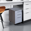 Nero Executive 3 Drawer Mobile Pedestal Anthracite Under White Office Desk with Drawers in Modern Office Setting