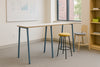 Nestro Metal 2 Piece Canteen Hightop Table with A Leg with Stools and Bookshelf in Breakout Setting
