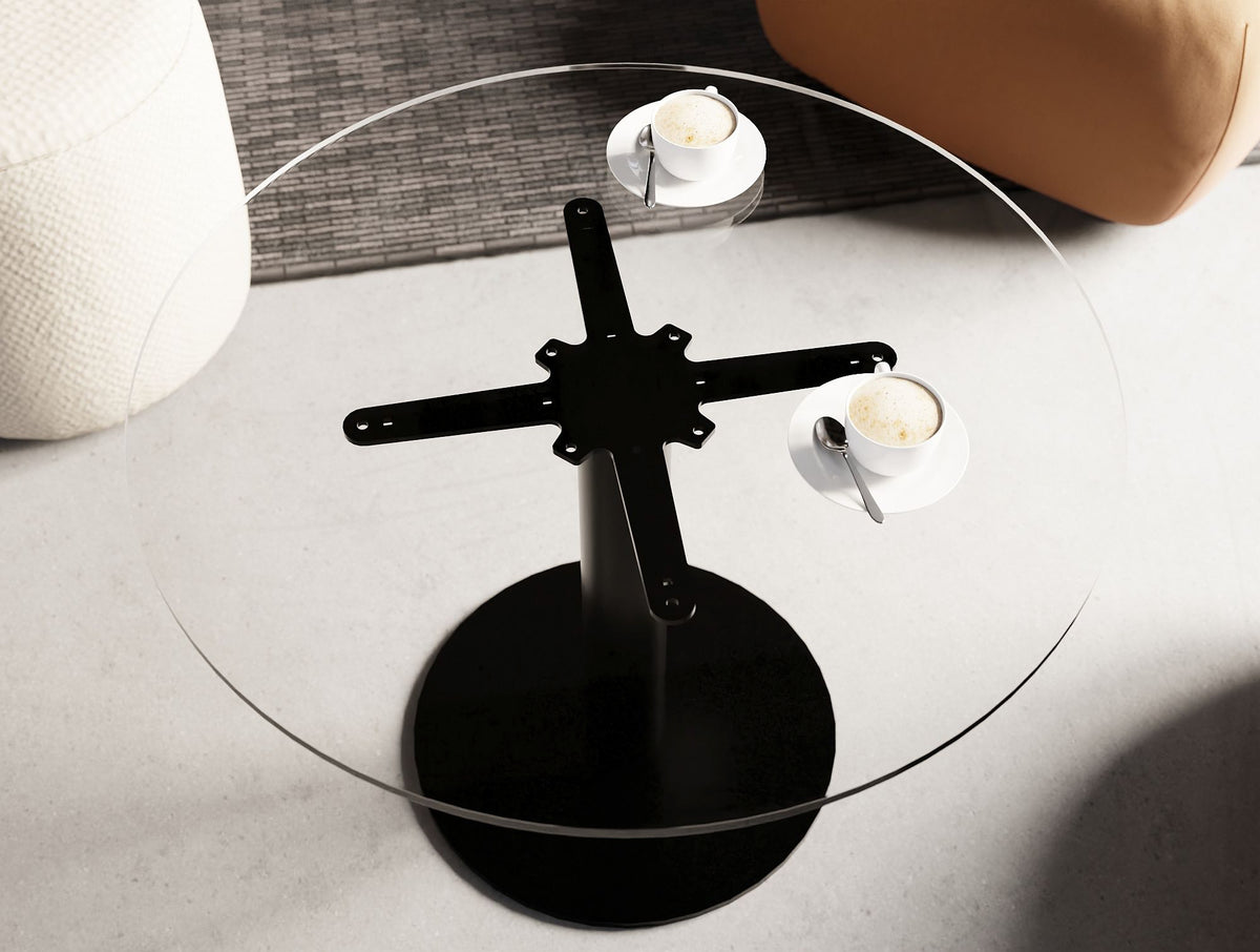 Nexis Round Glass Top Table in Lounge Setting