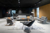 Nome Loose Backrest Lounge Chair in Grey with Grey Rocking Chair and Oval Shaped Low Table in Living Room Setting