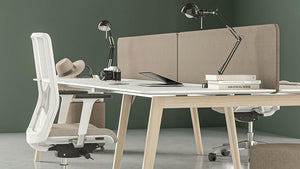 Narbutas Nova Wood Desk With Wooden Legs In Two Toned Finish With Grey Armchair And Tub Chair In Office Setting