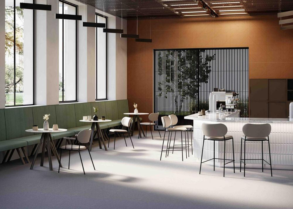 Nuta Light Upholstered Chair With Banquet Seating And Round Table In Resto Setting