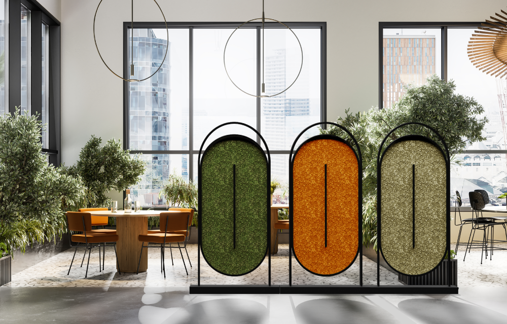 Ovale Wall and Freestanding Acoustic Moss Panel with Round Wooden Table and Indoor Plants in Breakout Setting