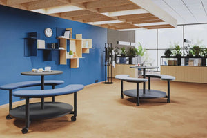 Picnix Round Table with Bench on Castors in Different Finishes with Oak Finish Cabinet and Black Coat Stand in Cafeteria Setting