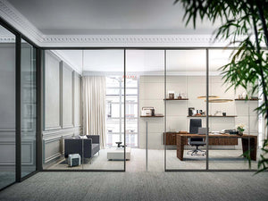 Quadrifoglio X10 Executive Desk In Ebony Finish With Black Boardroom Chair And Wooden Cupboard In Office Setting