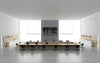 Rectangular Boardroom Table in Light Oak Finish with Task Chairs and Bookshelves in Modern Office Setting