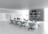 Rectangular Meeting Room Table with Cube Legs in White Finish with Bookshelves and Tub Chair in Collaborative Setting