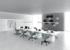 Rectangular Meeting Room Table with Cube Legs in White Finish with Bookshelves and Tub Chair in Collaborative Setting