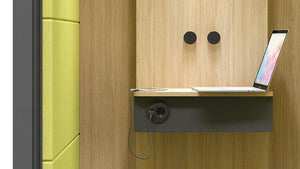 Narbutas Silent Room S Phone Booth In Black Exterior Finish With Blue Modular Sofa And White Planter In Reception Setting